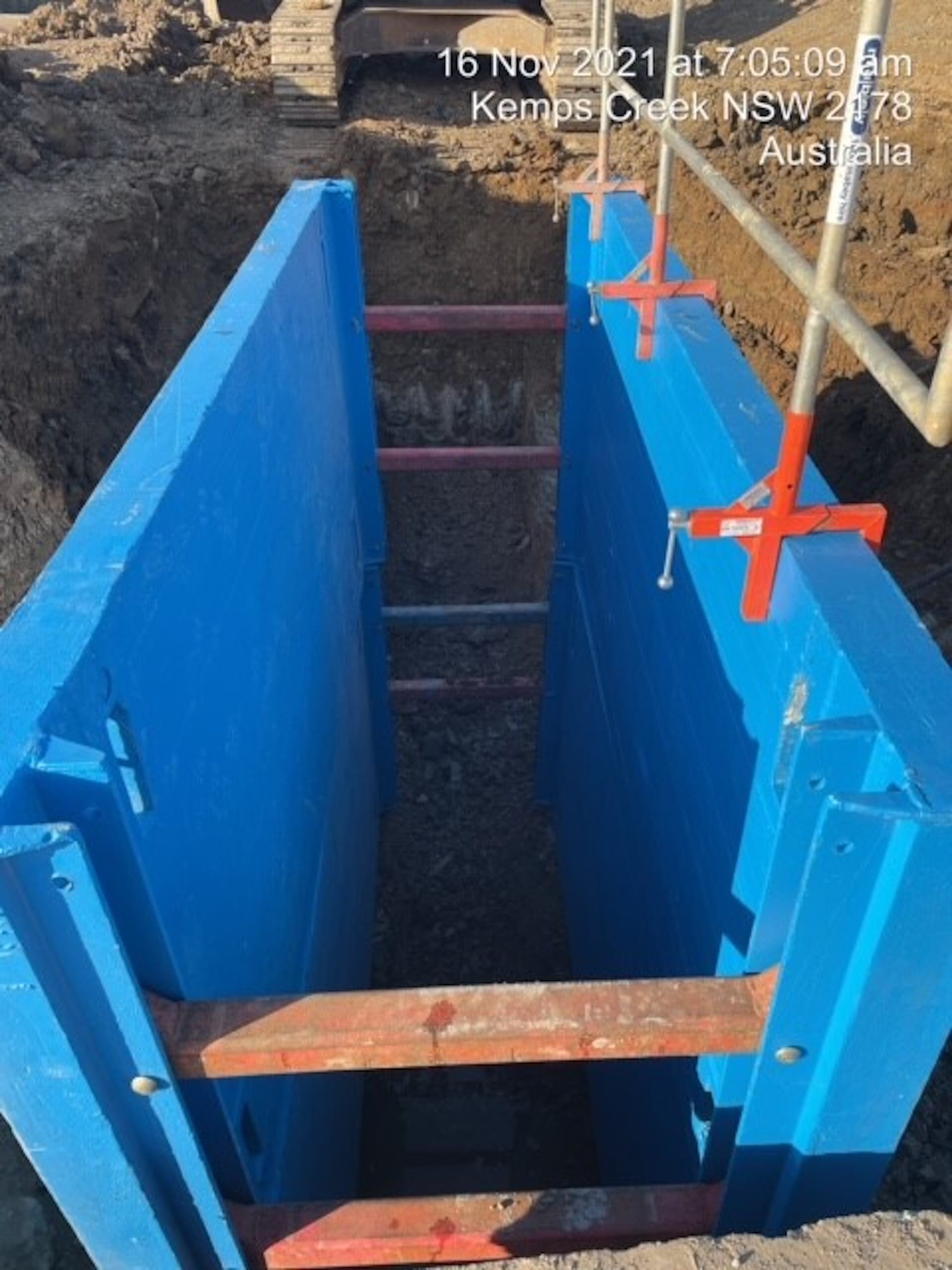 Lightweight trench box Ultra Shields being used with small machinery for safe and easy trench shoring