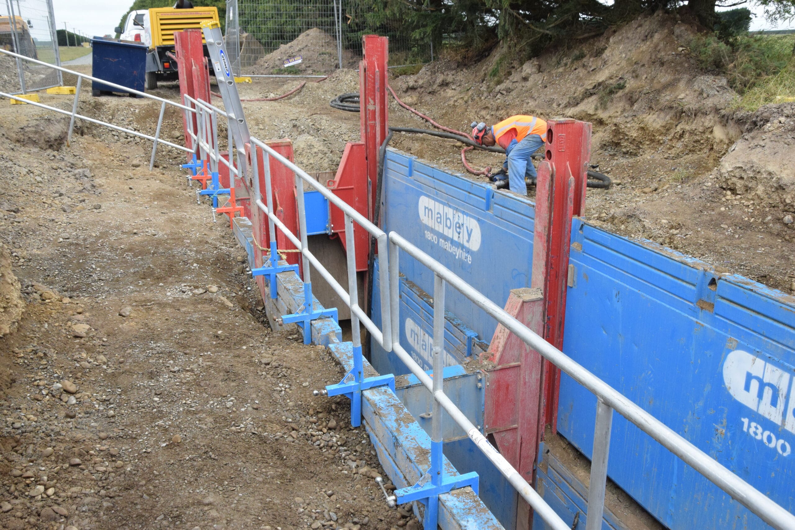 Side view of Mabey hydraulic trench shoring panels supporting excavation walls during infrastructure works