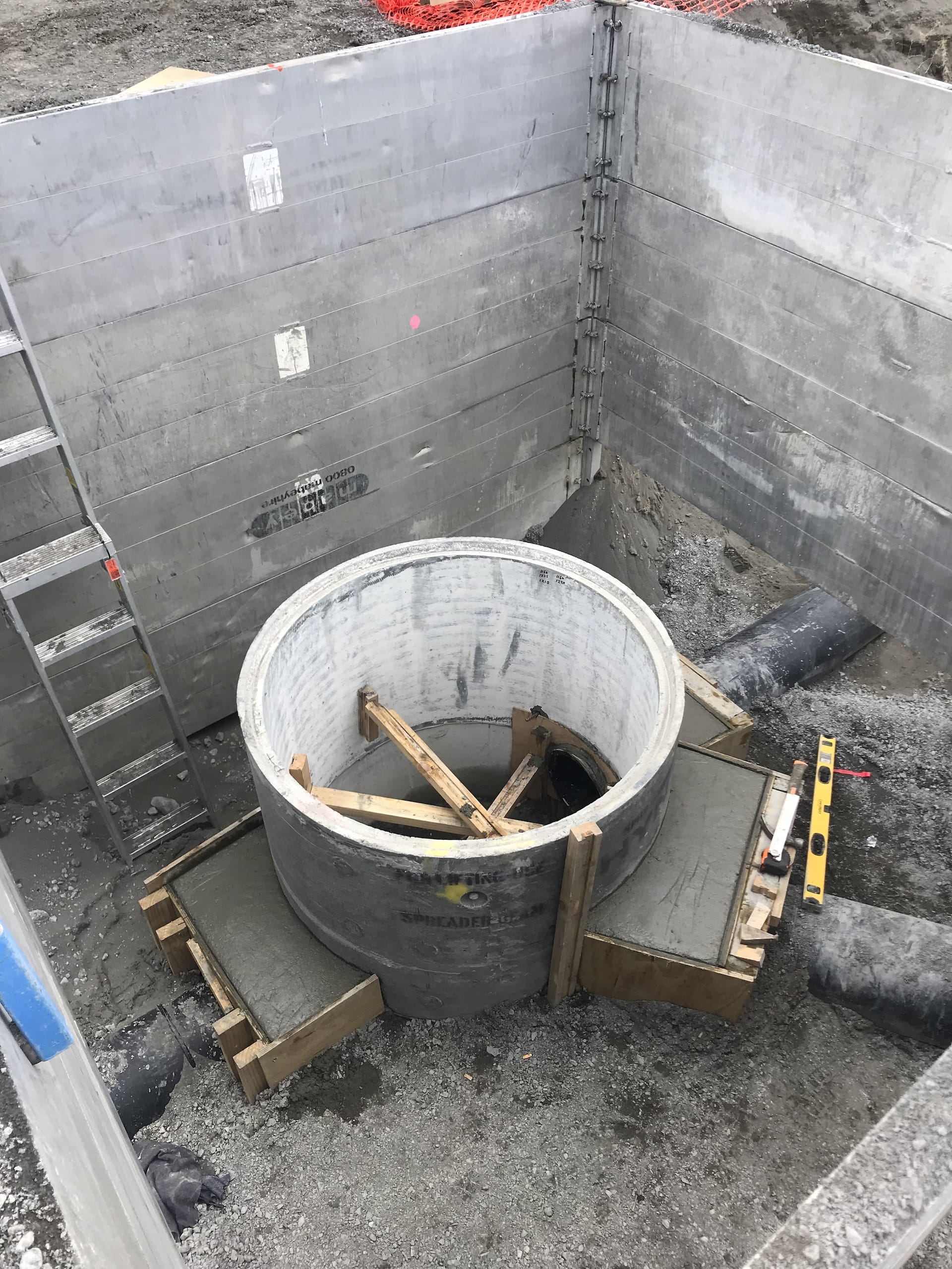 Aluminium modular trench shoring around concrete manhole during installation