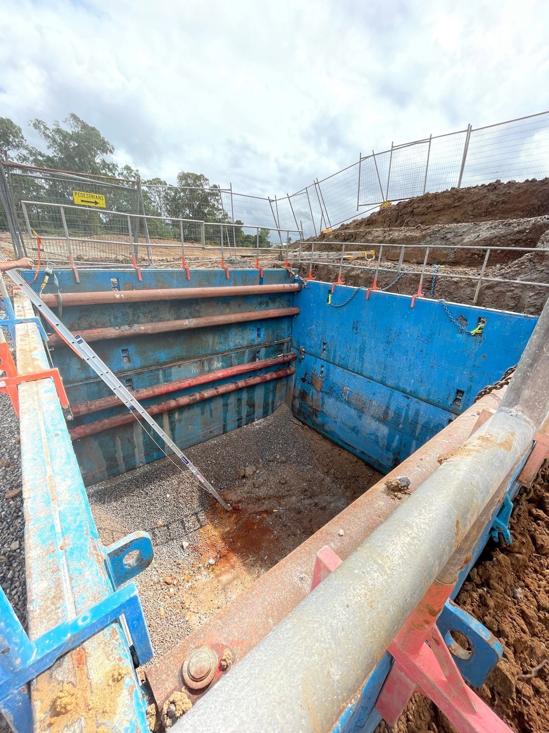 Heavy duty steel trench shields with reinforced rails for maximum durability on construction sites