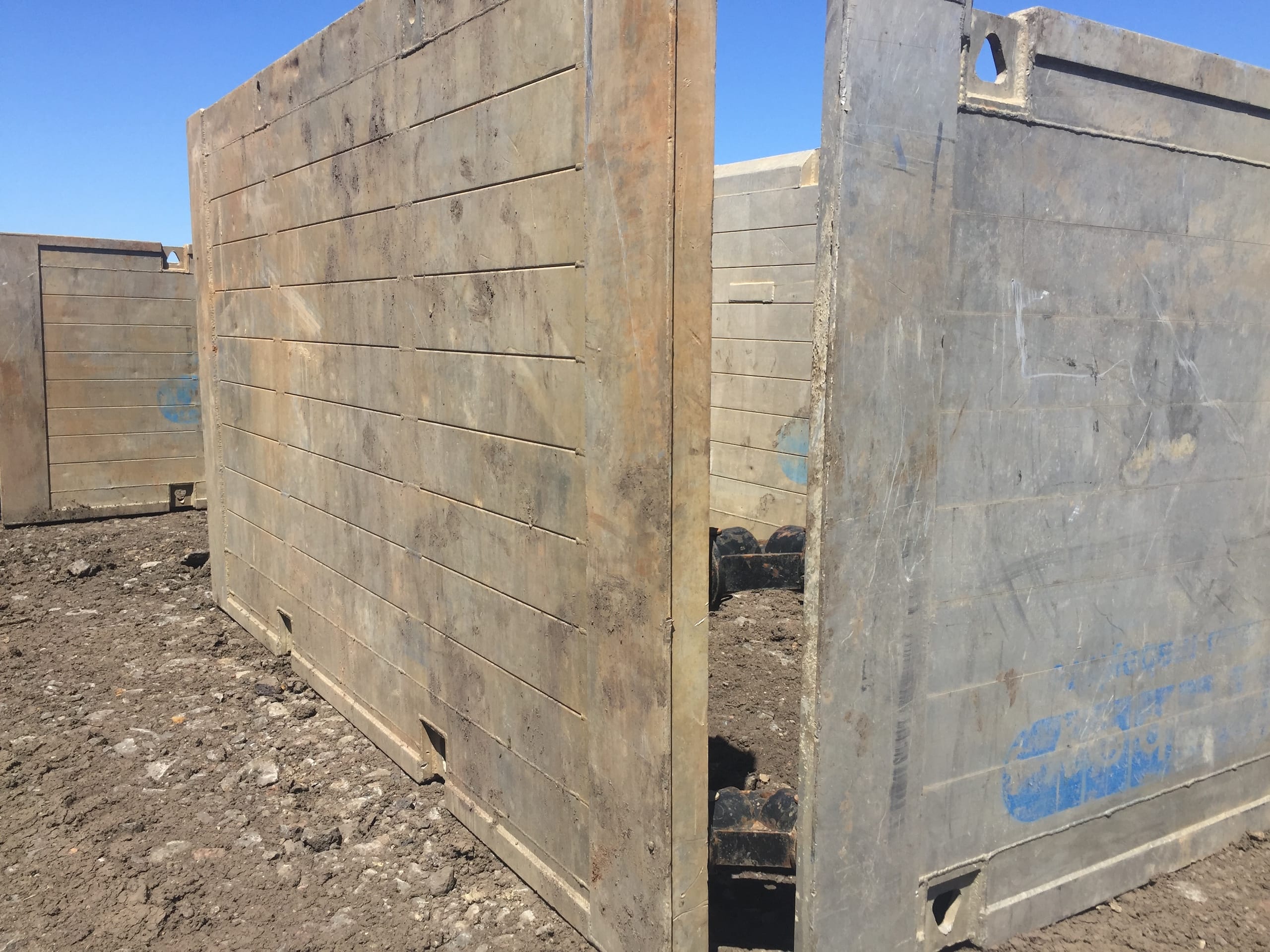 Aluminium trench drag box panels on site, weathered from use but built for strong and safe shoring